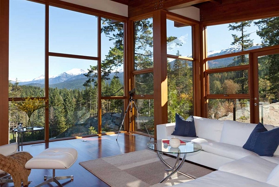 Large glass doors and windows offer panoramic views from the living room