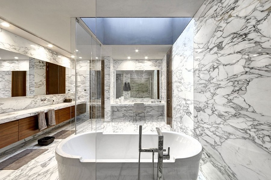 Lavish master bath draped in marble