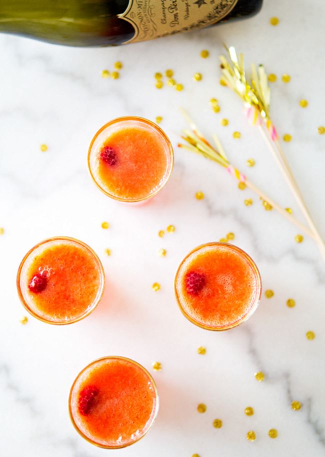 Mango raspberry bellinis