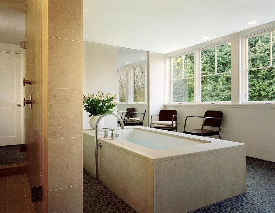 Master bath with a view of the lush landscape canopy outside