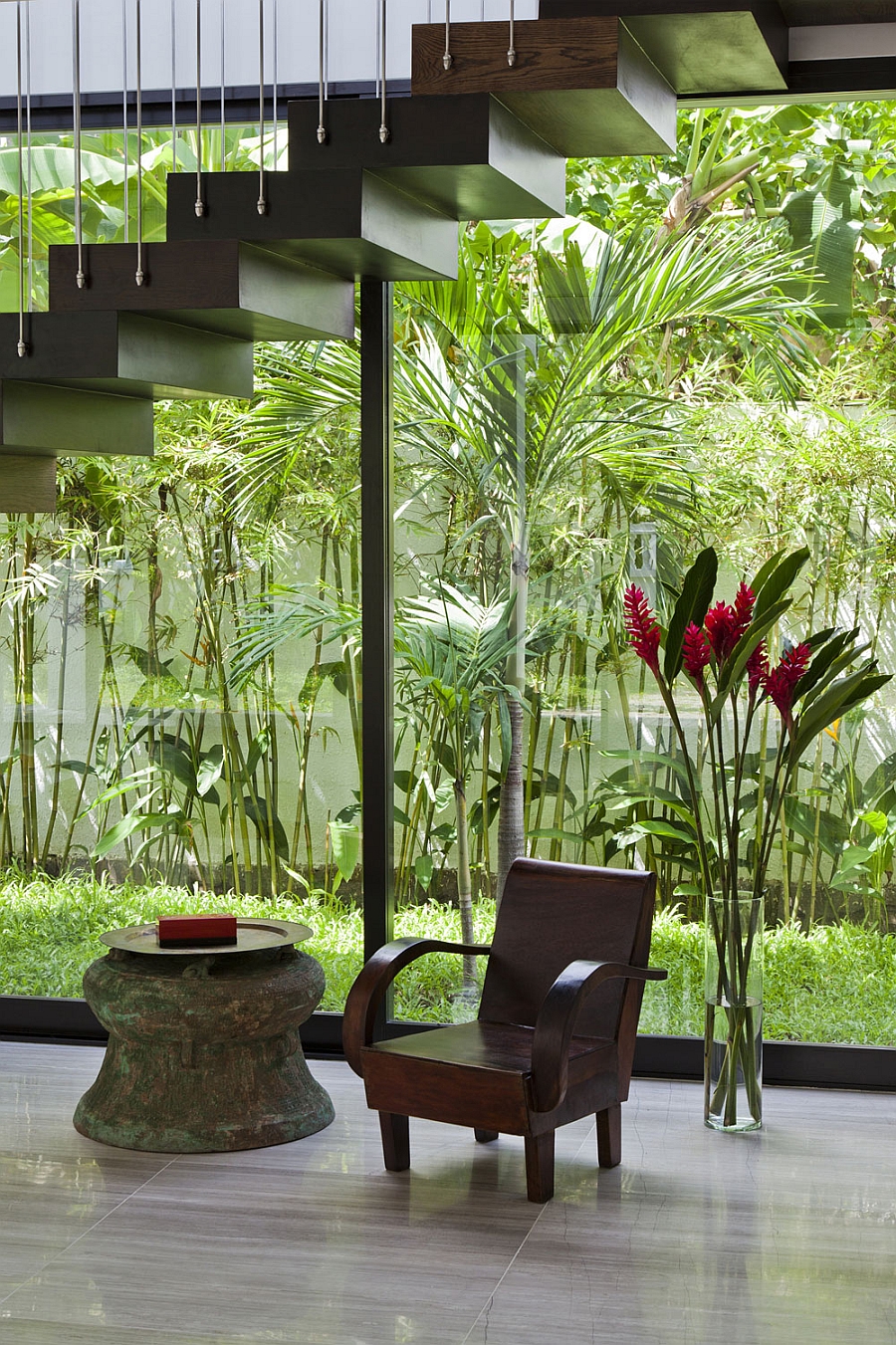 Natural greenery outside becomes a part of the indoors