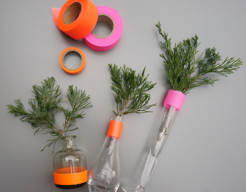 Neon holiday centerpiece with fresh greenery