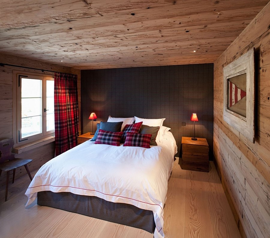 Neutral color palette in the chalet bedroom with pops of red