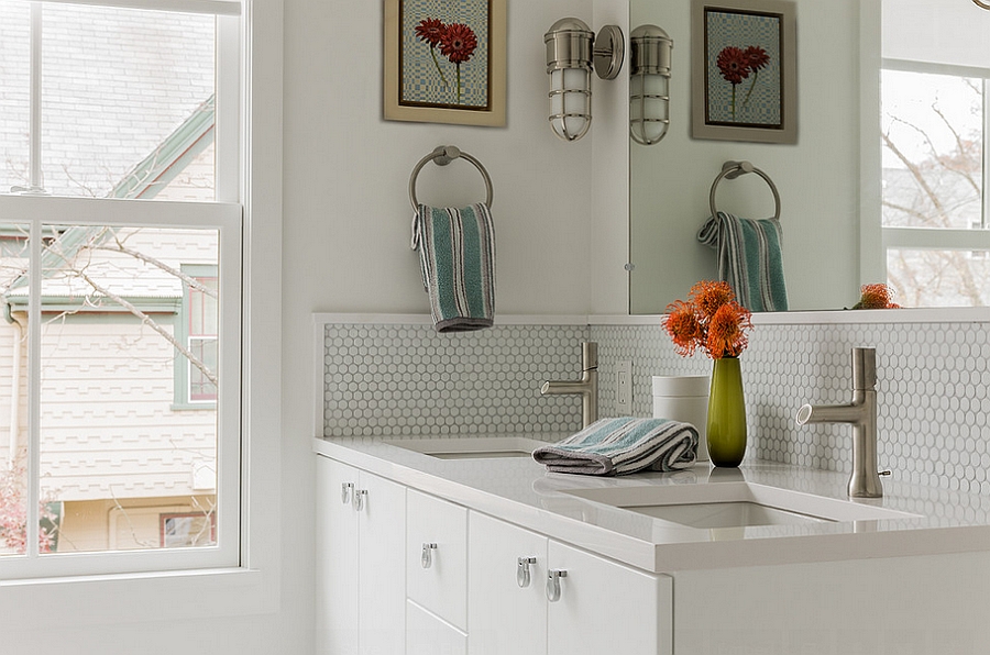 Painted wood trim highlights the penny tile section of the bathroom