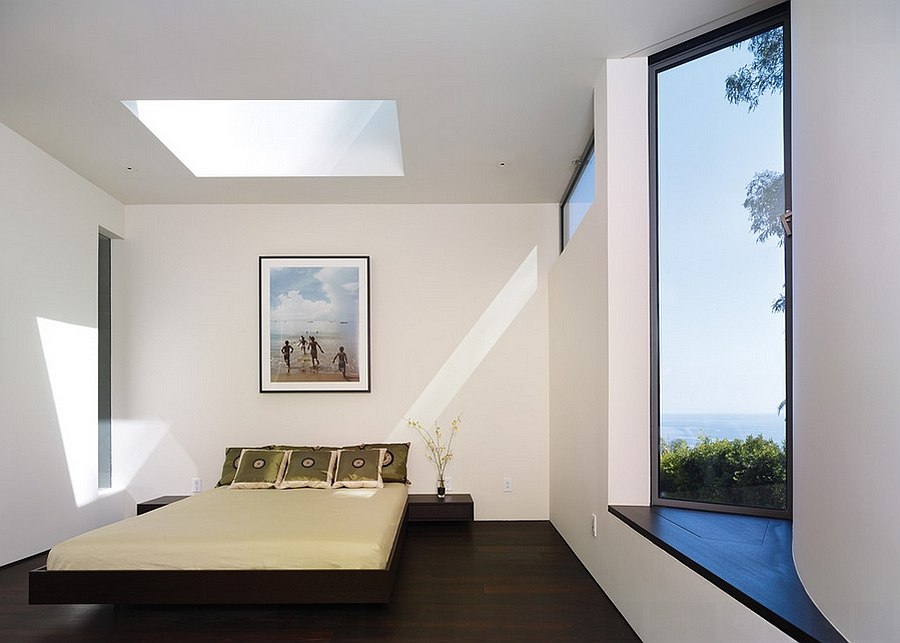 Peel-out window with ocean view and skylight transform the ambiane of the bedroom