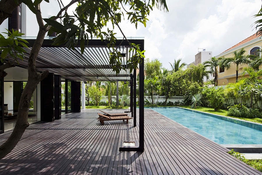 Pergola structure offers ample shade next to the pool area