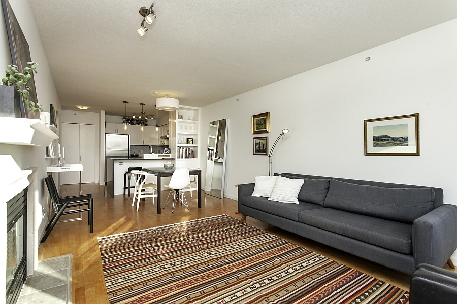 Plush couch and area rug define the the living room area