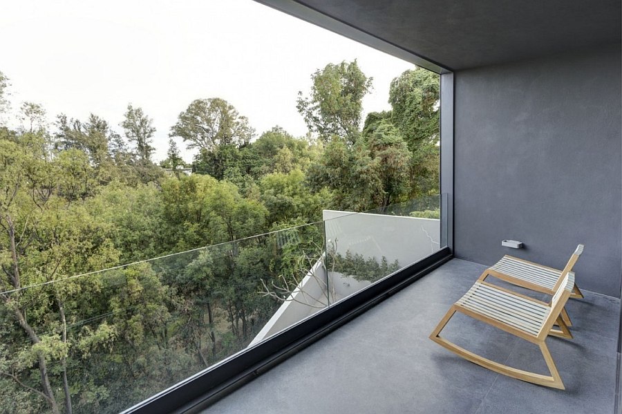 Recessed balcony of the house offers lovely view of the canopy outside