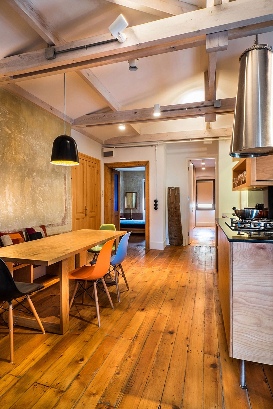 Renovated apartment dining space and kitchen with a blend of varied textures