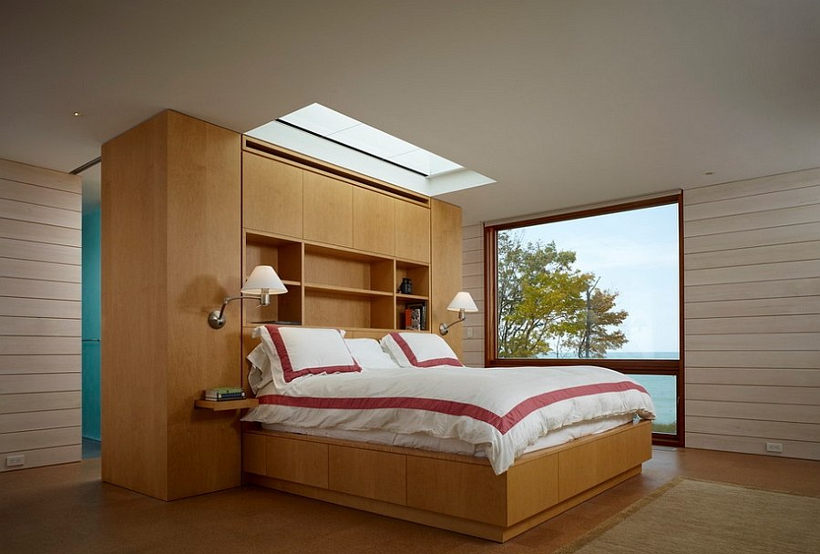 Skylight above the headboard gives the ceiling an exciting twist [Design: Wheeler Kearns Architects]