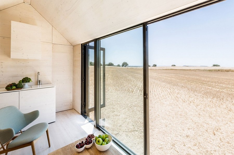 Sliding glass doors bring in ample natural ventilation