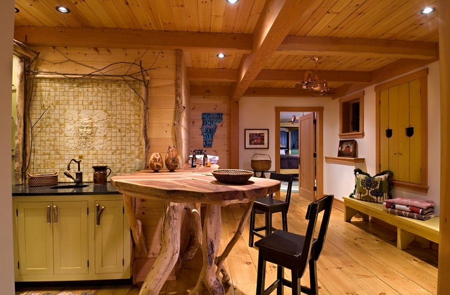 Small custom island crafted from natural tree trunks [Design: Laurel Feldman Interiors]