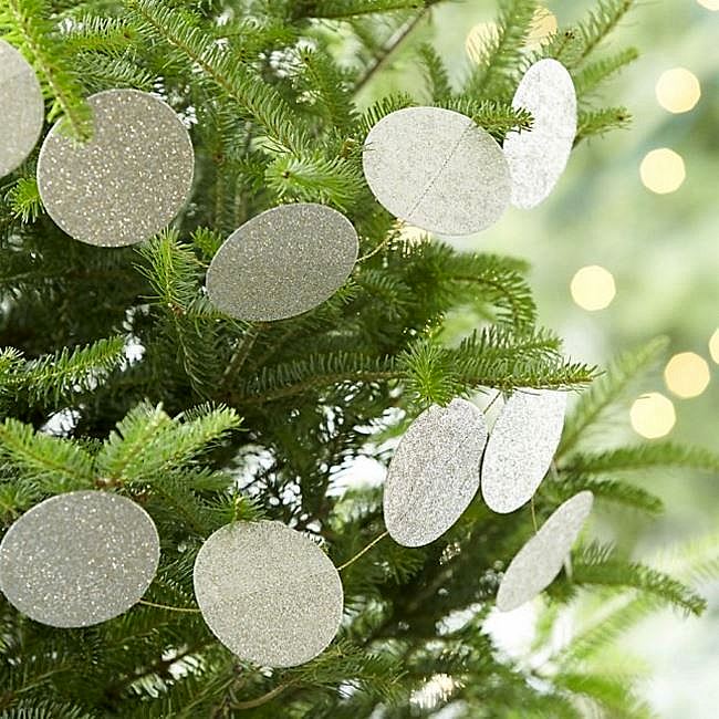 Sparkly garland on fresh greenery