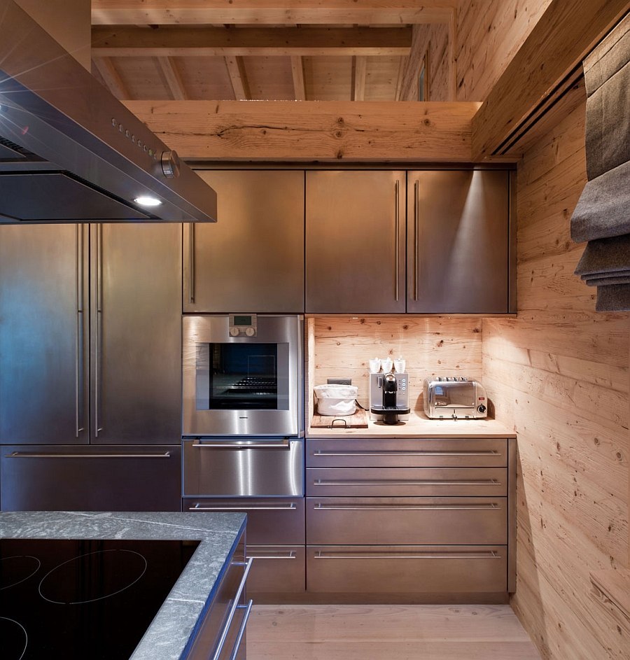 Stainless steel, stone and wood meet inside the chalet kitchen