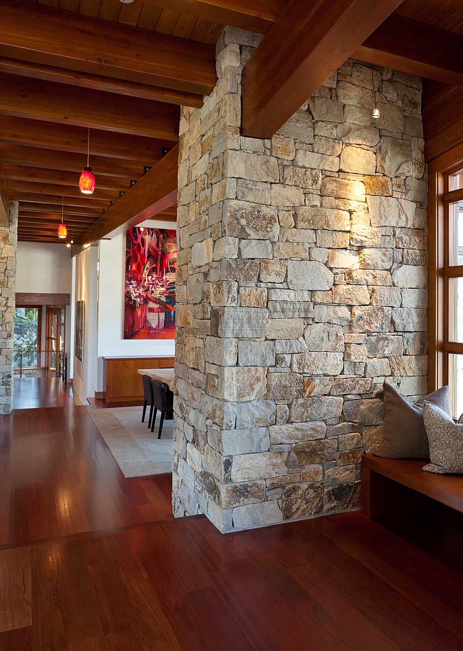 Stone wall brings a touch of rustic charm to the interior