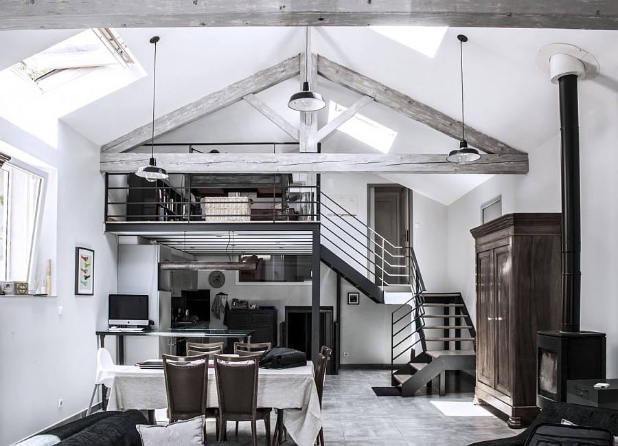 Vaulted ceiling and exposed wooden beams give the transformed home a classic appeal