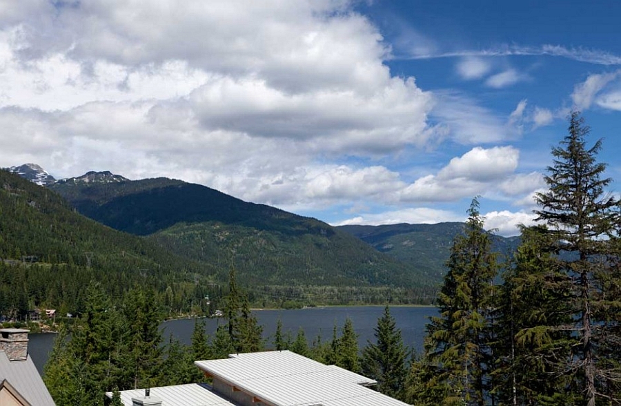 View of the distant lake, mountains and forest from the chalet