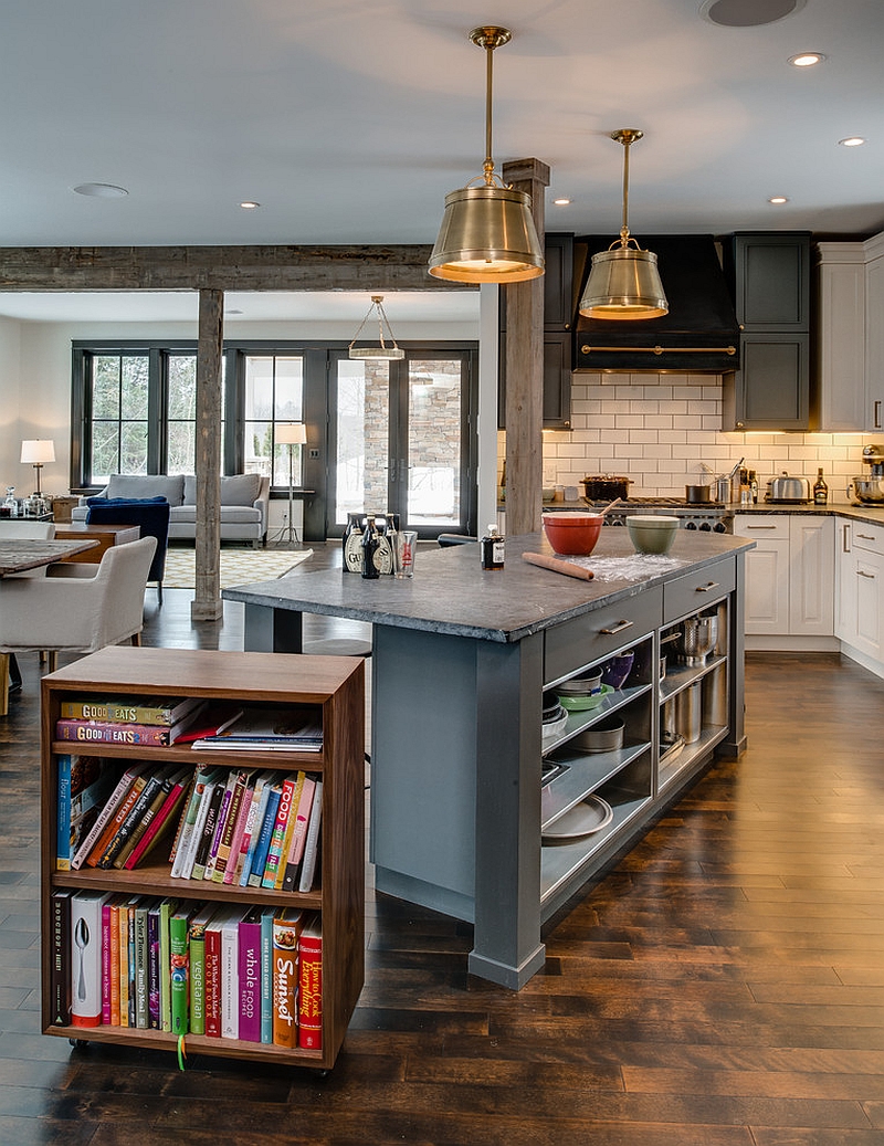 Walnut bookshelf that rolls out from the kitchen island