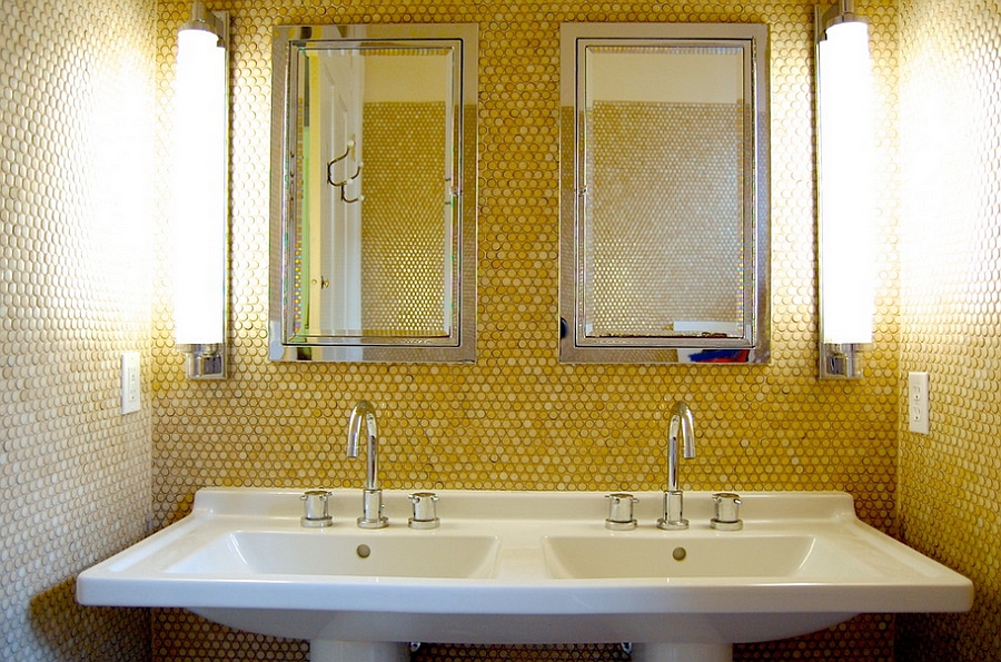 Yellow penny tiles add golden glint to the small bathroom [Photography: Corynne Pless]