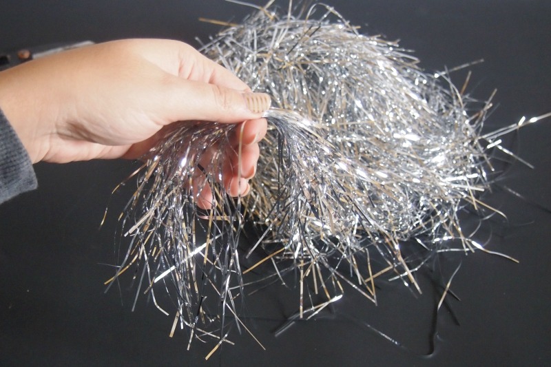 collect-tinsel-in-one-hand
