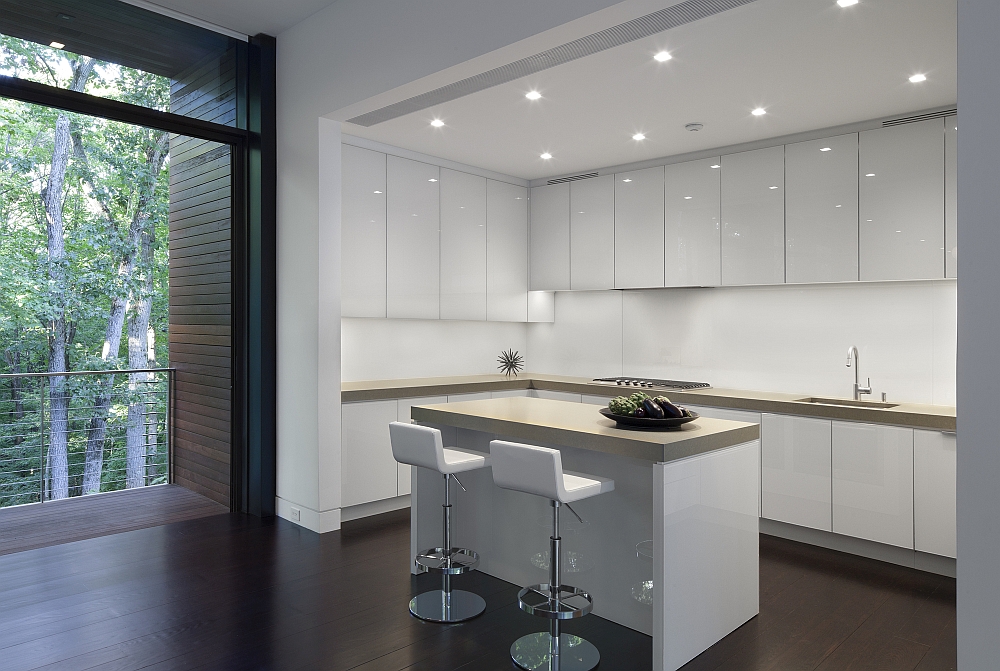 All-white contemporary kitchen with a breakfast zone