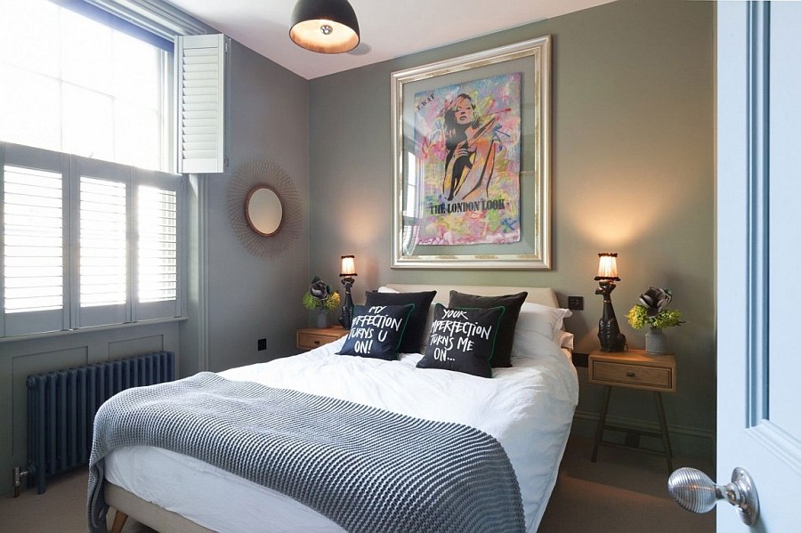 Art work above the bed adds a pop of color to the bedroom