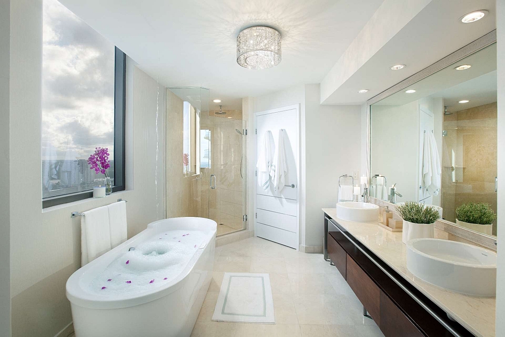 Bathroom with ocean views and standalone bathtub in white