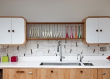 Bespoke-tiled-backsplash-and-unique-cupboads-give-the-space-a-stunning-look-217x155