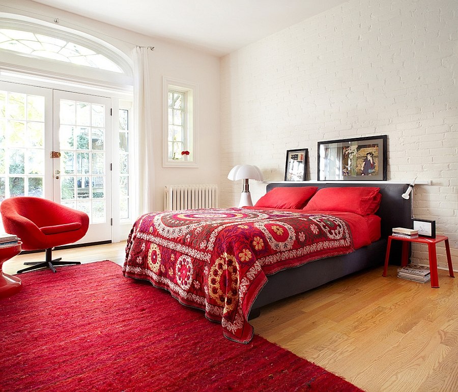 Brick wall in white gives the bedroom textural contrast