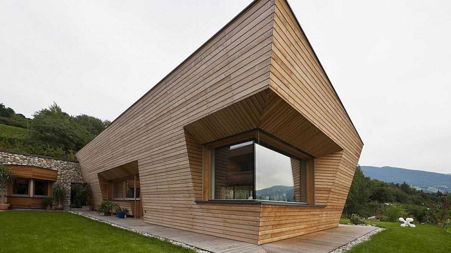 Clean, straight lines of the facade are softened by the elgant use of wood