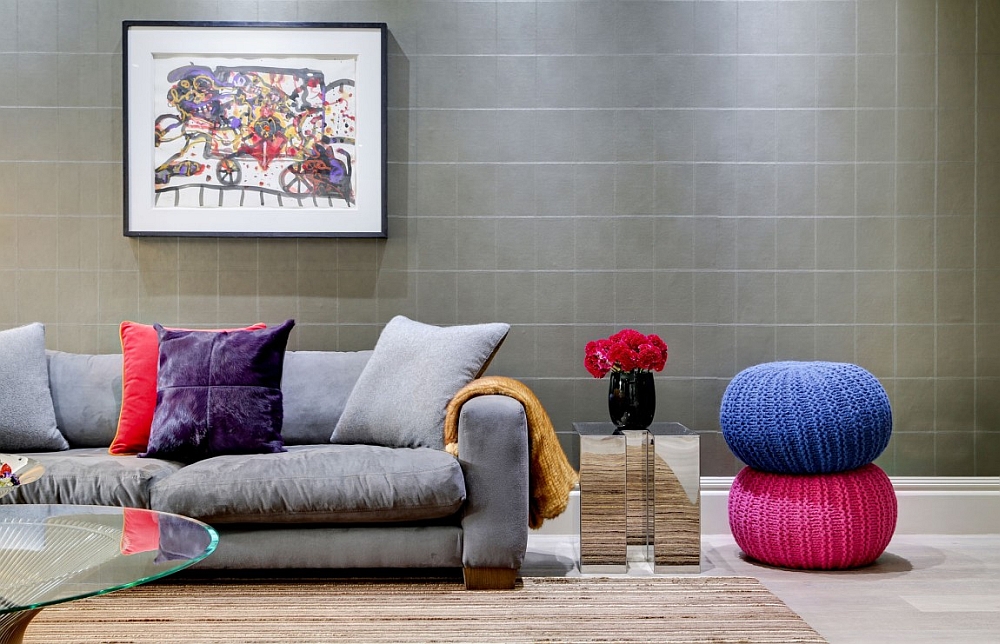 Colorful throw pillows and plush ottomans add textural and visual beauty to the bachelor pad