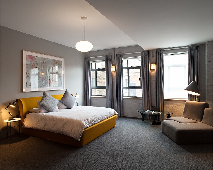 Contemporary bedroom with a colorful bed in yellow