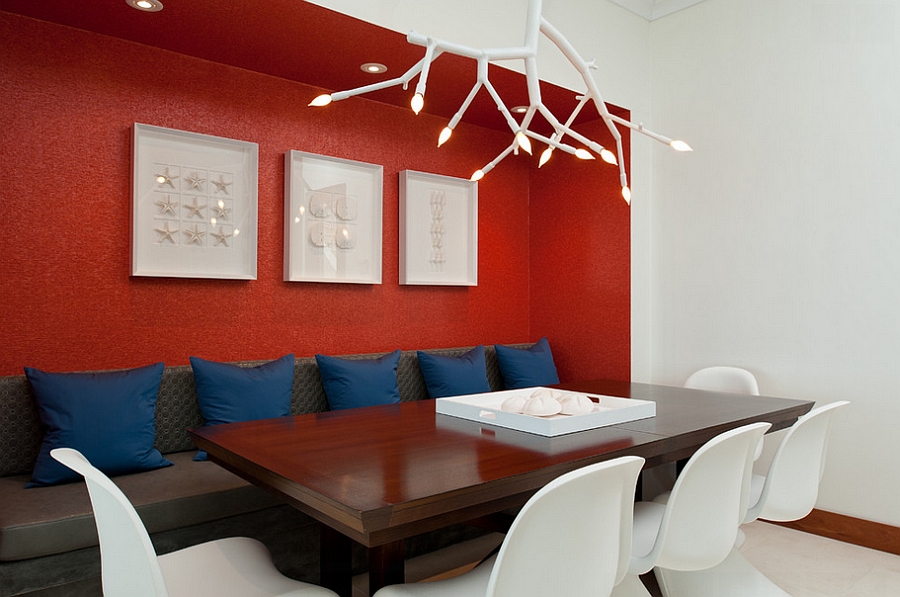 Contemporary dining room uses red as an accent hue [Design: LKID]