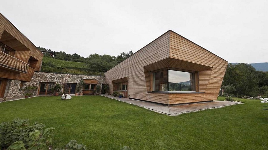 Contemporary exterior of the home blends in with the scenic landscape