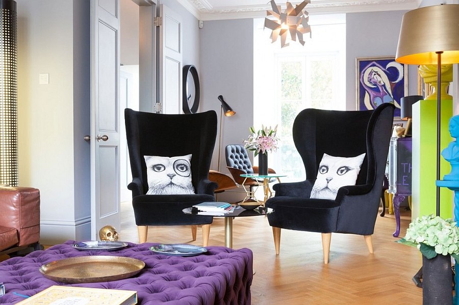 Contemporary wingback chairs and imaginative throw pillows in the living room