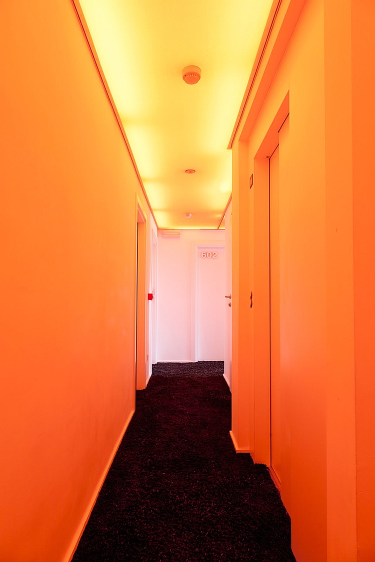 Corridor of the Pantone Hotel draped in orange