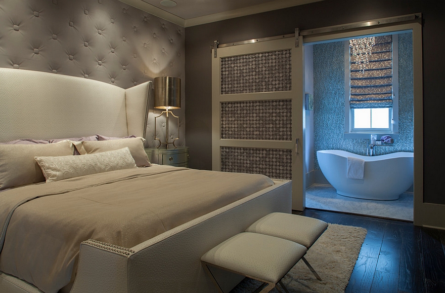 Cozy modern bedroom with gray tufted wall [Design: Geoff Chick & Associates]