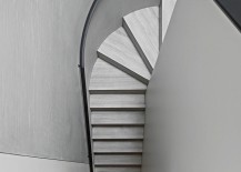 Curving-staircase-stands-in-contrast-with-simple-rectilinear-form-of-the-house-217x155