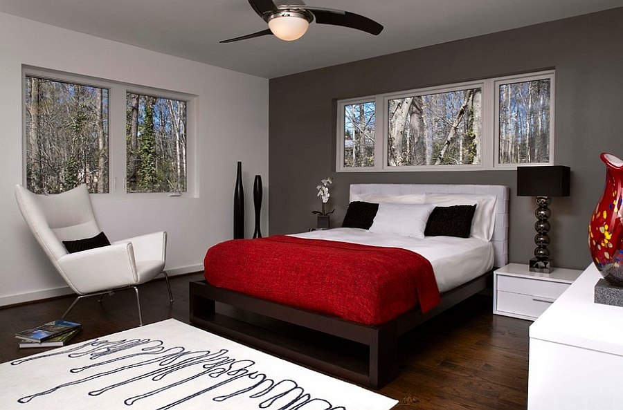 Dark gray accent wall and pops of black anchor the lovely room