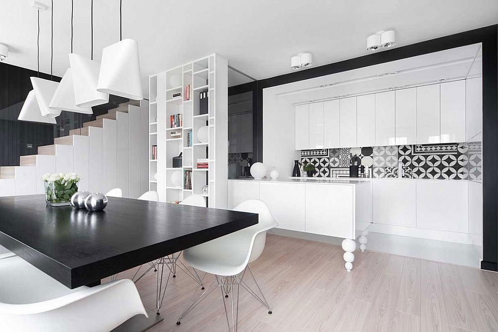 Eames chairs and creative pendants shape the dining room