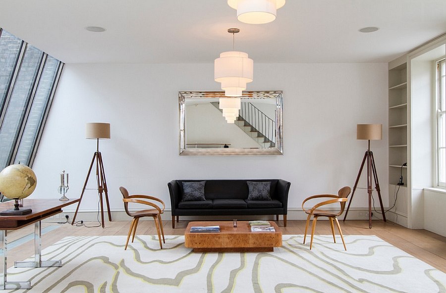 Eclectic living space with twin tripod floor lamps [Photography: Chris Snook]