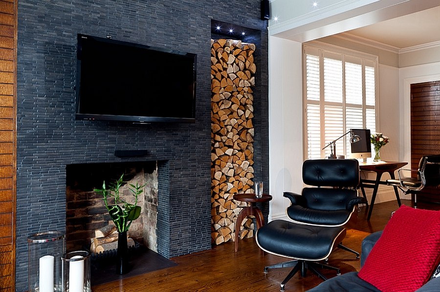 Elegantly stacked wood brings visual contrast to the dark living space [Design: Boutique Homes]