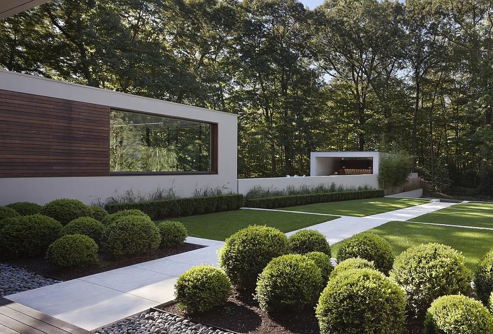 Fabulous walkways and curated gardens surround the renovated home