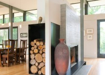 Fireplace-and-floating-wood-storage-unit-separate-the-living-and-dining-rooms-217x155