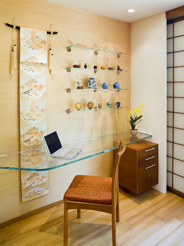 Floating glass desk and simple accessories shape this home office