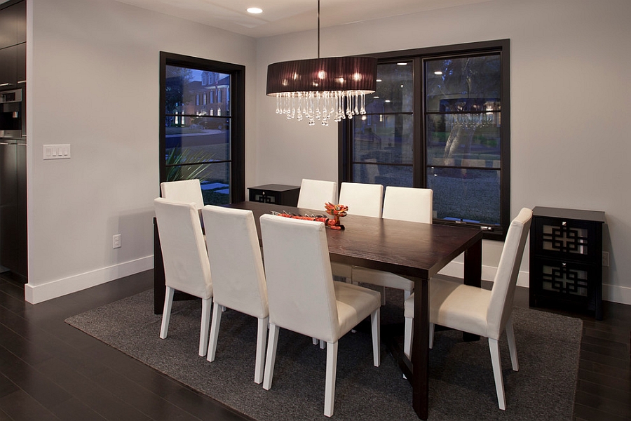 Gorgeous chandelier brings glamour to the cool dining space