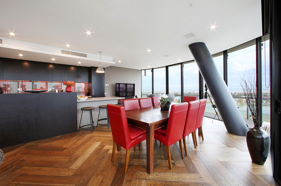 Gorgeous dining room with a lovely view and a splash of red [Design: Melbourne Contemporary Kitchens]