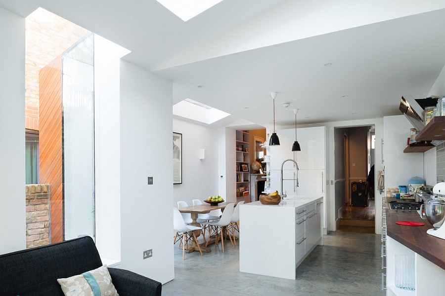 Gorgeous modern social kitchen and dining space in white