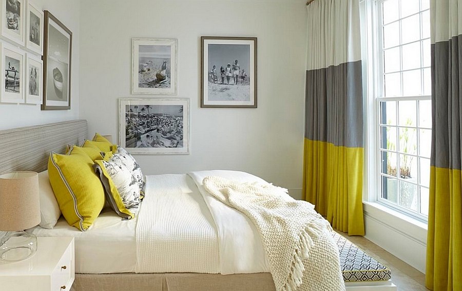 Gray and yellow bedroom with vintage black and white photograph on the walls