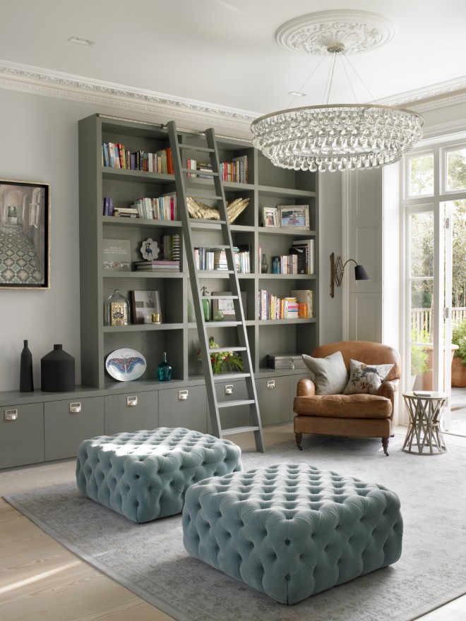 Grey Built-In Bookcase with Blue Tufted Ottomans